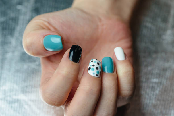 Blue black polka dot nail design