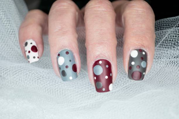 Grey maroon polka dot nail design