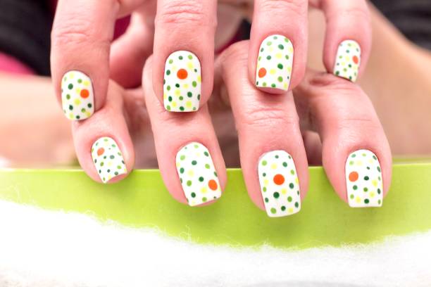 Multi coloured polka dot nail design
