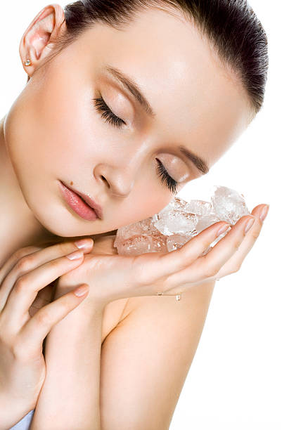 Benefits of rubbing ice cube on face